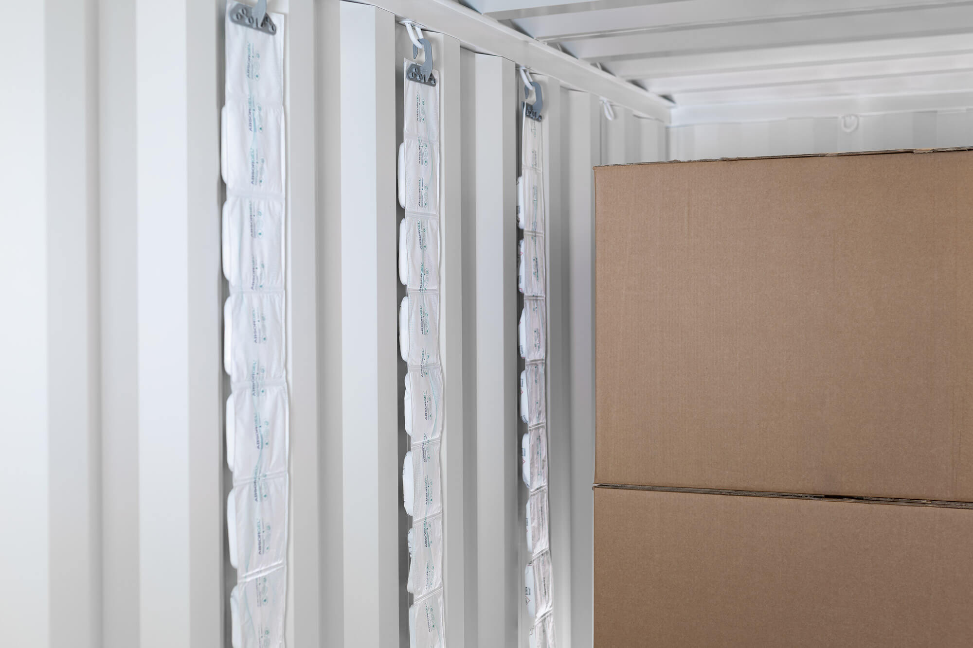 Container desiccant hanging in a shipping container